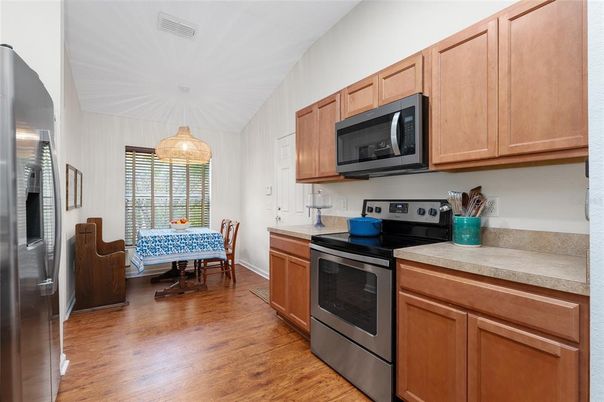 Dining room, Interior, Kitchen, Pendant Lights, Stainless Steel Appliances, Wood Texture Flooring