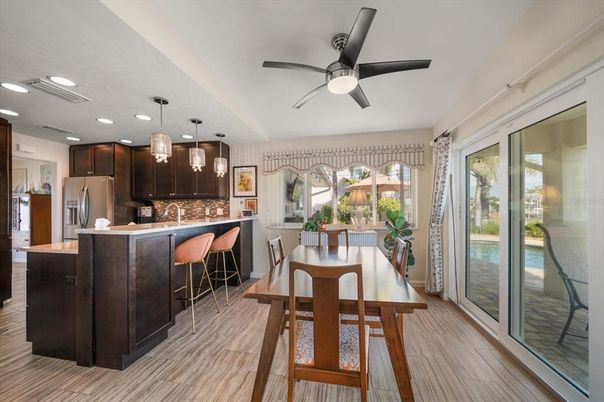 Dining room, Interior, Kitchen, Pendant Lights, Recessed Lighting, Stainless Steel Appliances, Wood Texture Flooring