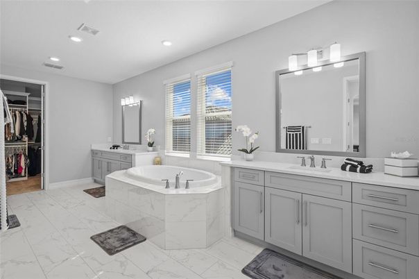 Bathroom, Dual Sink Vanities, Interior, Marble, Recessed Lighting, Walk-in Closets