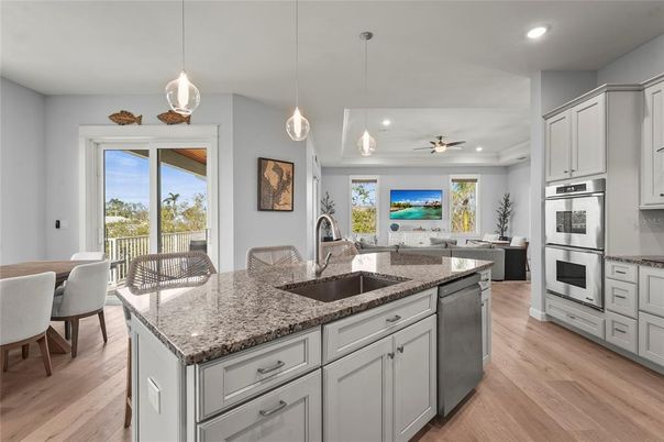 Dining room, Interior, Kitchen, Pendant Lights, Recessed Lighting, Stainless Steel Appliances, Wood Texture Flooring