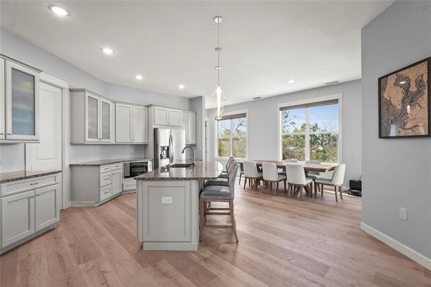 Dining room, Interior, Kitchen, Pendant Lights, Recessed Lighting, Stainless Steel Appliances, Wood Texture Flooring