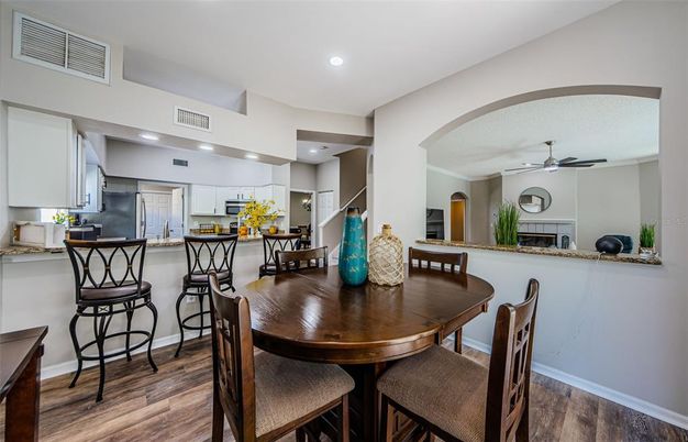 Dining room, Interior, Kitchen, Recessed Lighting, Stainless Steel Appliances, Wood Texture Flooring
