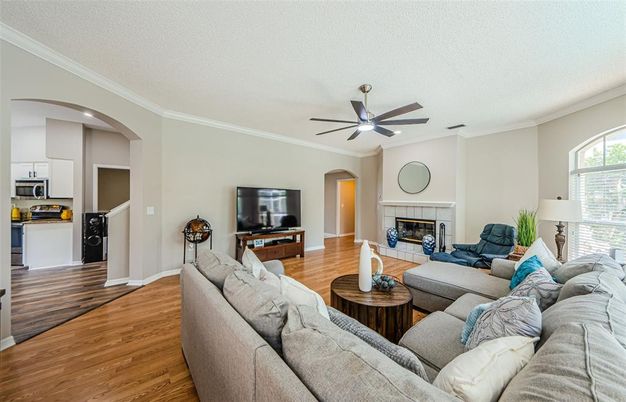 Fireplace, Interior, Kitchen, Living room, Recessed Lighting, Stainless Steel Appliances, Wood Texture Flooring