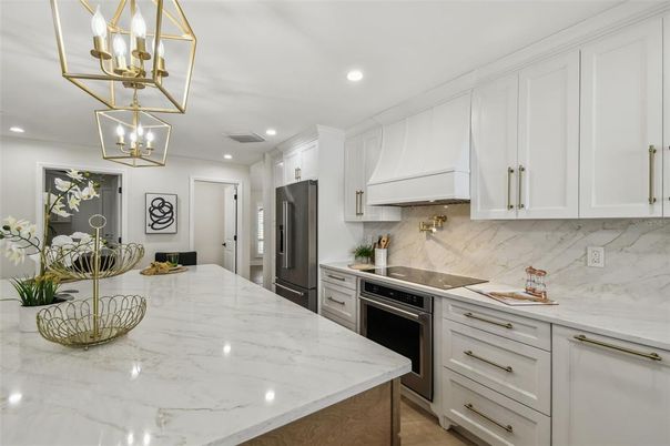 Interior, Kitchen, Marble Walls, Pendant Lights, Recessed Lighting, Stainless Steel Appliances
