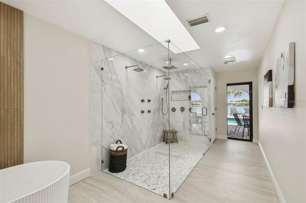 Bathroom, Glass Shower, Interior, Marble Walls, Recessed Lighting, Wood Texture Flooring