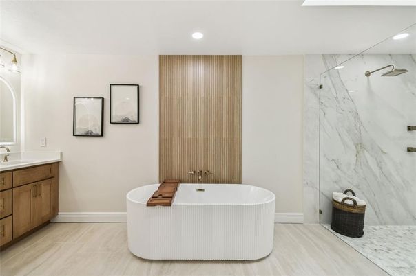 Bathroom, Free Standing Baths, Interior, Marble Walls, Recessed Lighting, Wood Texture Flooring