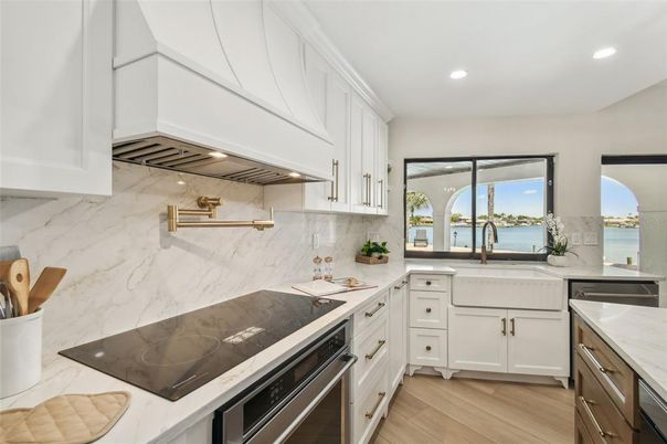 Interior, Kitchen, Marble Walls, Recessed Lighting, Stainless Steel Appliances, Water, Wood Texture Flooring