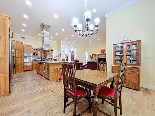 Chandelier, Dining room, Interior, Kitchen, Recessed Lighting, Stainless Steel Appliances, Wood Texture Flooring