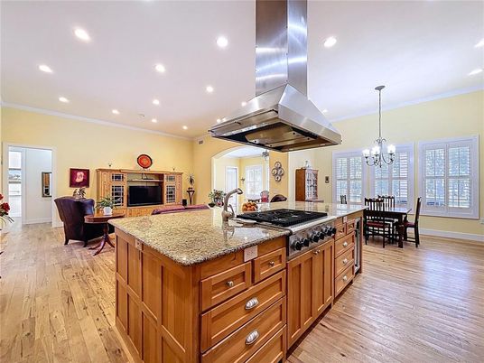 Chandelier, Dining room, Interior, Kitchen, Living room, Recessed Lighting, Stainless Steel Appliances, Wood Texture Flooring