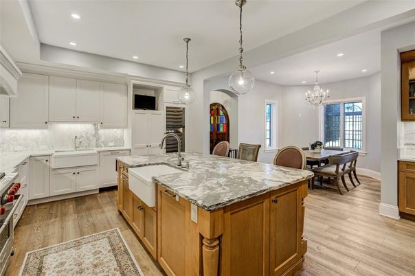 Chandelier, Dining room, Interior, Kitchen, Pendant Lights, Recessed Lighting, Stainless Steel Appliances, Wood Texture Flooring