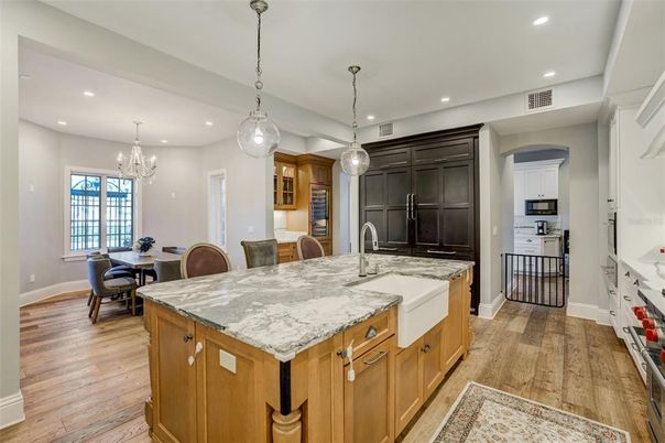 Chandelier, Dining room, Interior, Kitchen, Pendant Lights, Recessed Lighting, Stainless Steel Appliances, Wood Texture Flooring