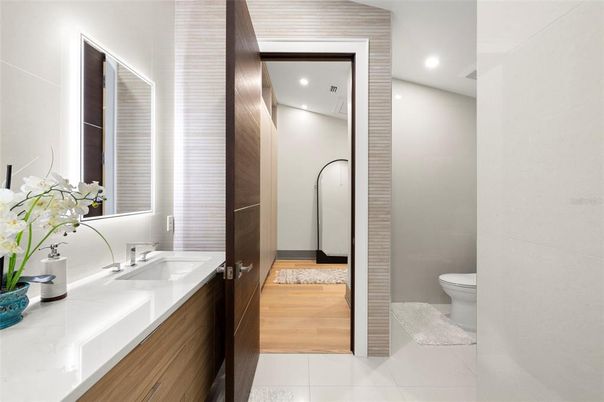 Bathroom, Dual Sink Vanities, Interior, Recessed Lighting, Wood Texture Flooring
