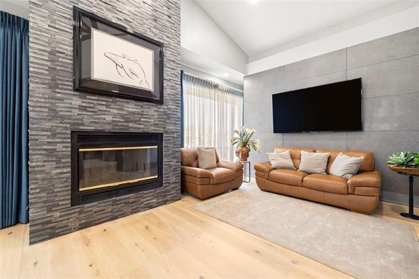 Fireplace, Interior, Living room, Recessed Lighting, Stone Walls, Wood Texture Flooring