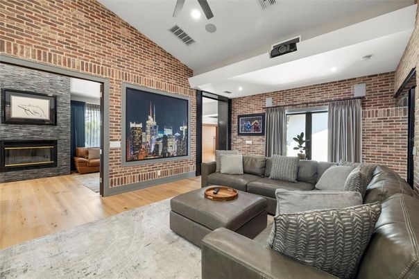 Fireplace, Interior, Living room, Recessed Lighting, Stone Walls, Wood Texture Flooring