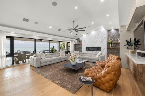 Dining room, Fireplace, Interior, Living room, Marble Walls, Recessed Lighting, Wood Texture Flooring