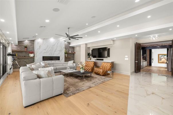 Fireplace, Interior, Living room, Marble, Marble Walls, Recessed Lighting, Stone Walls, Wood Texture Flooring