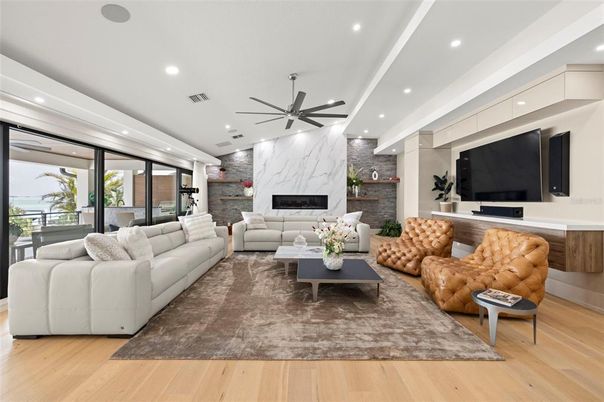 Fireplace, Interior, Living room, Marble Walls, Recessed Lighting, Stone Walls, Wood Texture Flooring