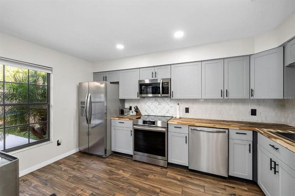 Interior, Kitchen, Recessed Lighting, Stainless Steel Appliances, Wood Texture Flooring