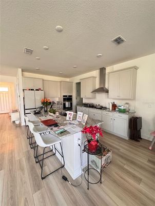Dining room, Interior, Kitchen, Recessed Lighting, Stainless Steel Appliances, Wood Texture Flooring