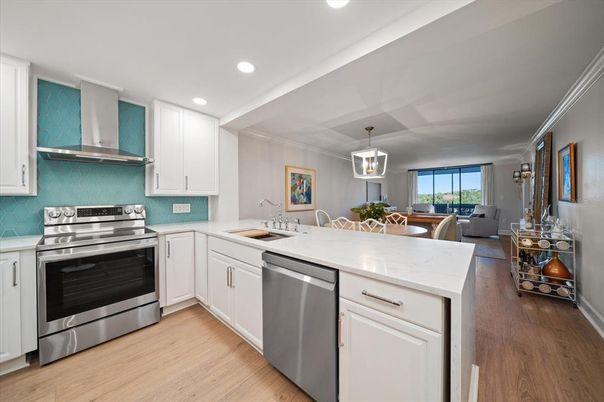 Dining room, Interior, Kitchen, Pendant Lights, Recessed Lighting, Stainless Steel Appliances, Wood Texture Flooring