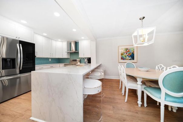 Dining room, Interior, Kitchen, Pendant Lights, Recessed Lighting, Stainless Steel Appliances, Wood Texture Flooring