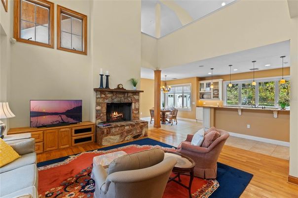Dining room, Fireplace, Interior, Living room, Pendant Lights, Recessed Lighting, Wood Texture Flooring