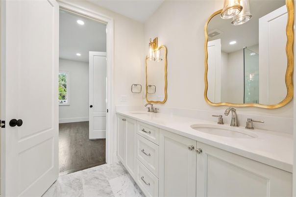 Bathroom, Dual Sink Vanities, Interior, Marble, Recessed Lighting, Wood Texture Flooring