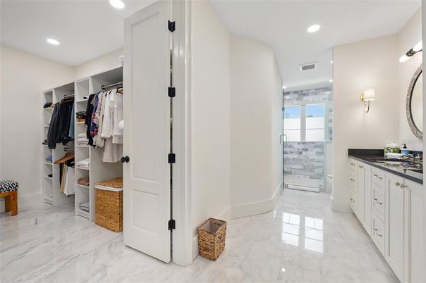Bathroom, Dual Sink Vanities, Interior, Marble, Recessed Lighting, Walk-in Closets