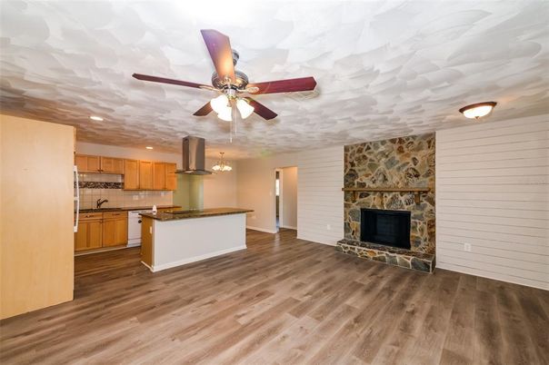 Fireplace, Interior, Kitchen, Recessed Lighting, Wood Texture Flooring