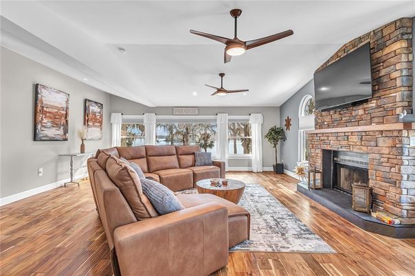 Fireplace, Interior, Living room, Recessed Lighting, Stone Walls, Wood Texture Flooring