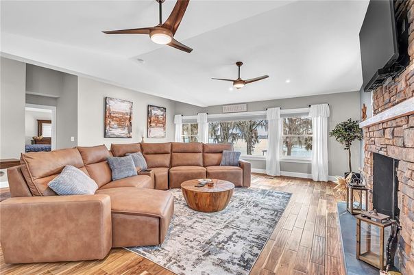 Fireplace, Interior, Living room, Recessed Lighting, Stone Walls, Wood Texture Flooring