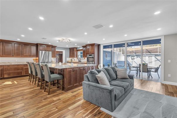 Dining room, Interior, Kitchen, Living room, Recessed Lighting, Stainless Steel Appliances, Wood Texture Flooring