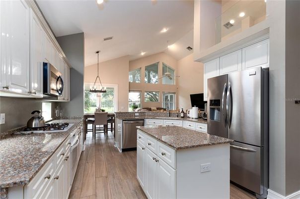 Dining room, Interior, Kitchen, Pendant Lights, Recessed Lighting, Stainless Steel Appliances, Wood Texture Flooring