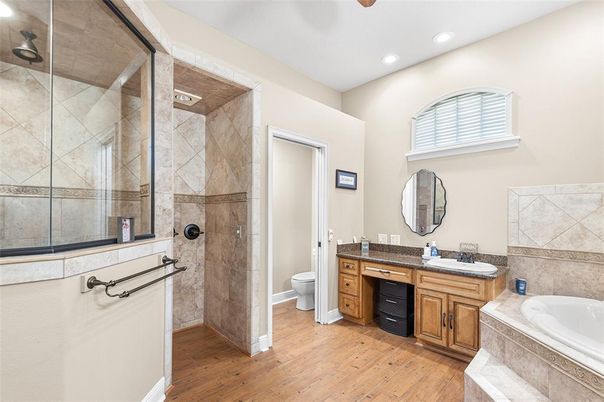Bathroom, Dual Sink Vanities, Glass Shower, Interior, Recessed Lighting, Wood Texture Flooring