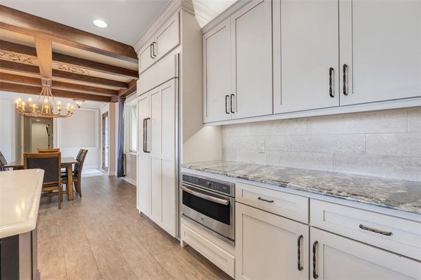 Chandelier, Dining room, Interior, Kitchen, Recessed Lighting, Stainless Steel Appliances, Wooden Beams, Wood Texture Flooring