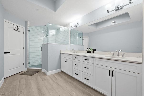Bathroom, Dual Sink Vanities, Glass Shower, Interior, Wood Texture Flooring