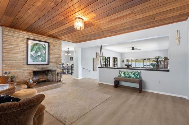 Chandelier, Dining room, Fireplace, Interior, Stone Walls, Wooden Ceilings, Wood Texture Flooring