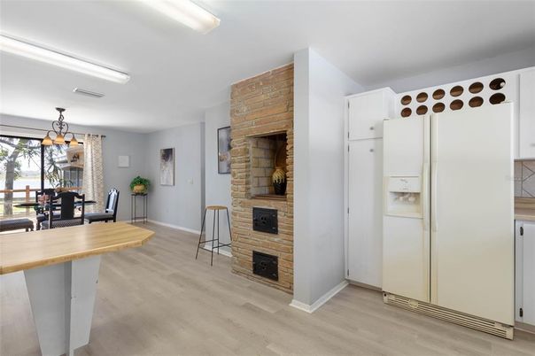 Dining room, Fireplace, Interior, Kitchen, Pendant Lights, Stone Walls, Wood Texture Flooring