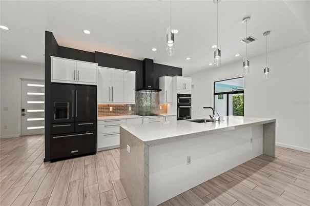 Interior, Kitchen, Pendant Lights, Recessed Lighting, Stainless Steel Appliances, Wood Texture Flooring