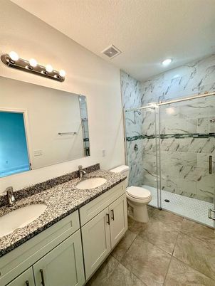 Bathroom, Dual Sink Vanities, Glass Shower, Interior, Marble Walls, Recessed Lighting