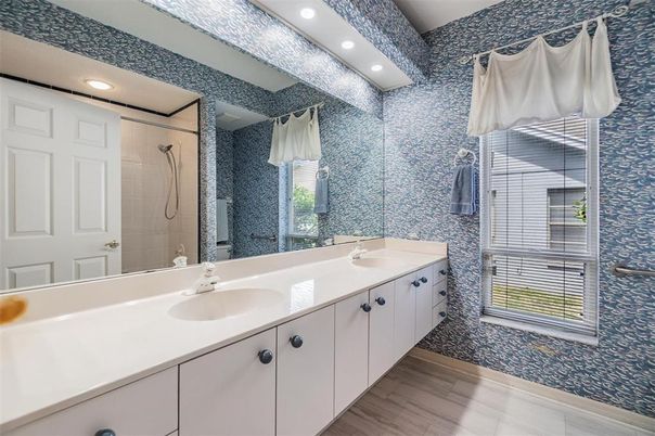 Bathroom, Dual Sink Vanities, Glass Shower, Interior, Recessed Lighting, Wood Texture Flooring