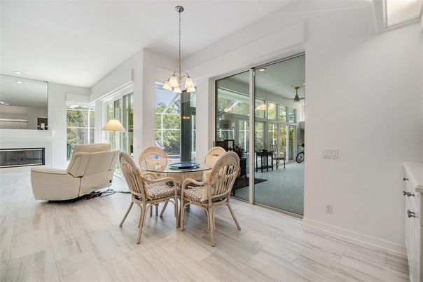 Chandelier, Dining room, Fireplace, Interior, Living room, Pendant Lights, Recessed Lighting, Wood Texture Flooring