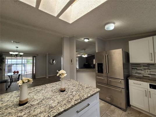 Chandelier, Dining room, Interior, Kitchen, Stainless Steel Appliances, Wood Texture Flooring