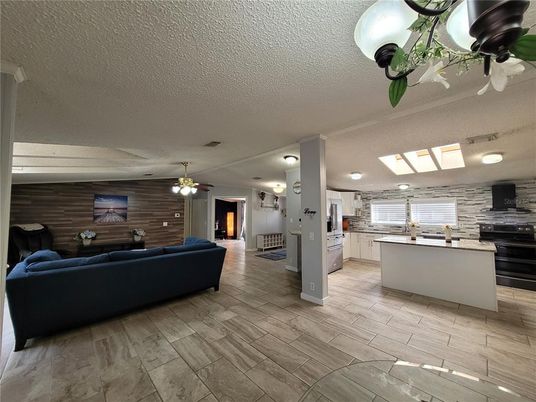 Fireplace, Interior, Kitchen, Living room, Stainless Steel Appliances, Stone Walls, Wood Texture Flooring