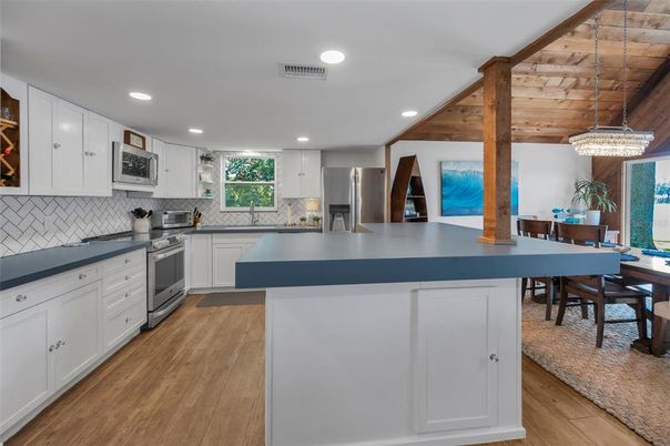Chandelier, Dining room, Interior, Kitchen, Pendant Lights, Recessed Lighting, Stainless Steel Appliances, Wooden Beams, Wooden Ceilings, Wood Texture Flooring
