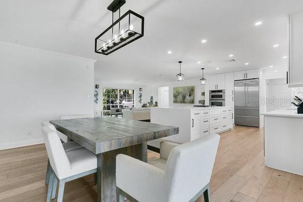 Dining room, Interior, Kitchen, Living room, Pendant Lights, Recessed Lighting, Stainless Steel Appliances, Wood Texture Flooring