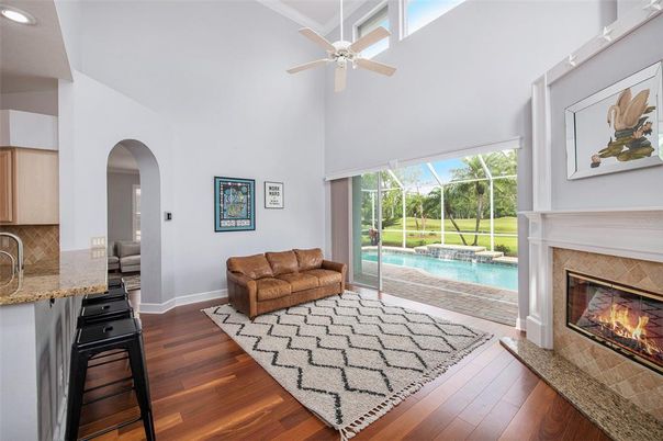 Fireplace, Interior, Pool, Recessed Lighting, Sun Room, Wood Texture Flooring