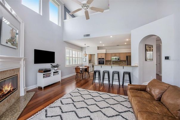 Dining room, Fireplace, Interior, Kitchen, Living room, Pendant Lights, Recessed Lighting, Stainless Steel Appliances, Wood Texture Flooring