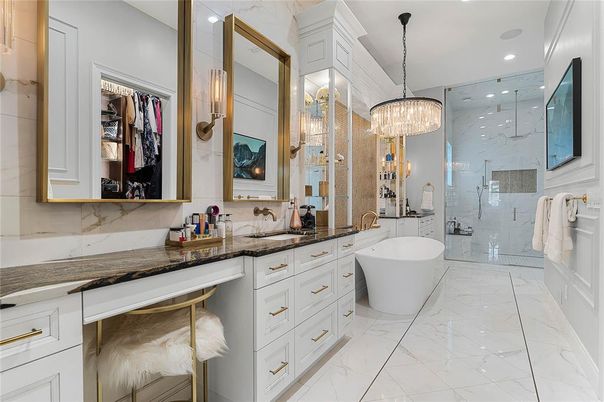 Bathroom, Chandelier, Dual Sink Vanities, Free Standing Baths, Glass Shower, Interior, Marble, Marble Walls, Recessed Lighting