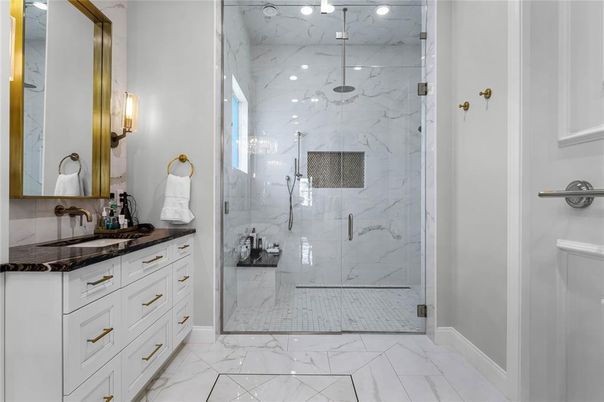 Bathroom, Dual Sink Vanities, Glass Shower, Interior, Marble, Marble Walls, Recessed Lighting